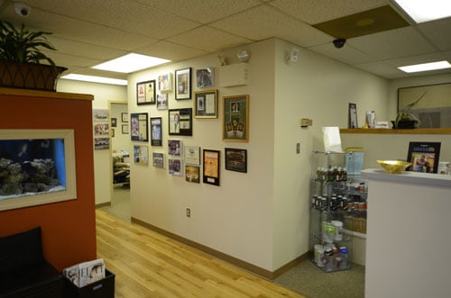 A clean, modern waiting room with seating and a reception area